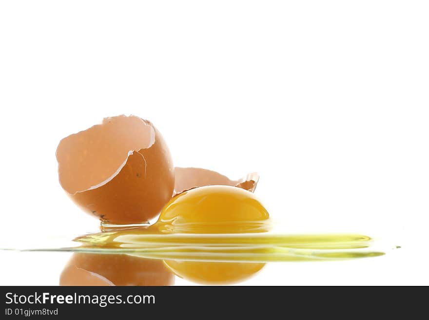 Broken egg on white background