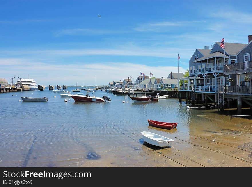 Houses beside a small harbor on a sunny day. Houses beside a small harbor on a sunny day