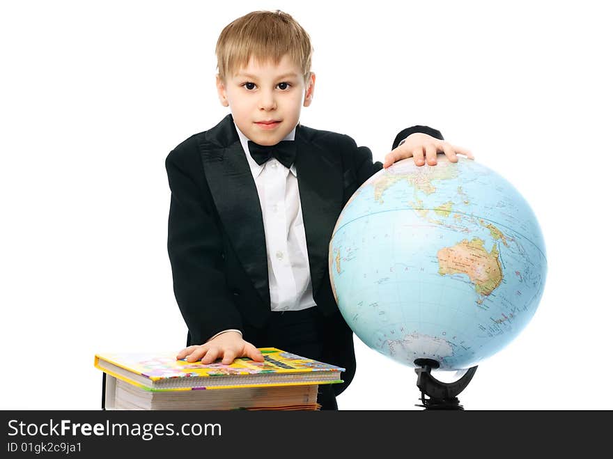 Little schoolboy with books and a globe against white background. Little schoolboy with books and a globe against white background