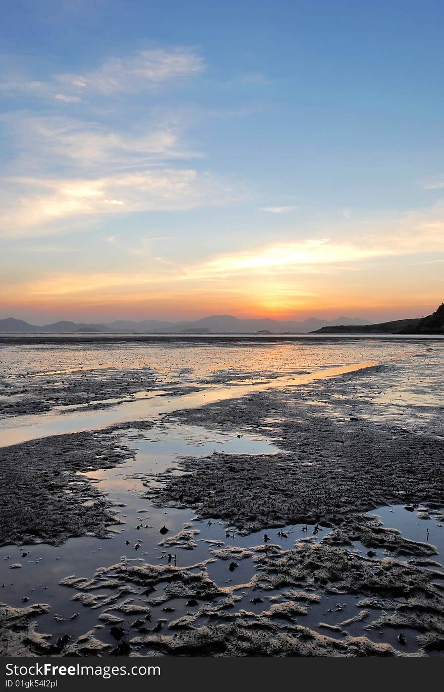 Sea mudflat and blue sky