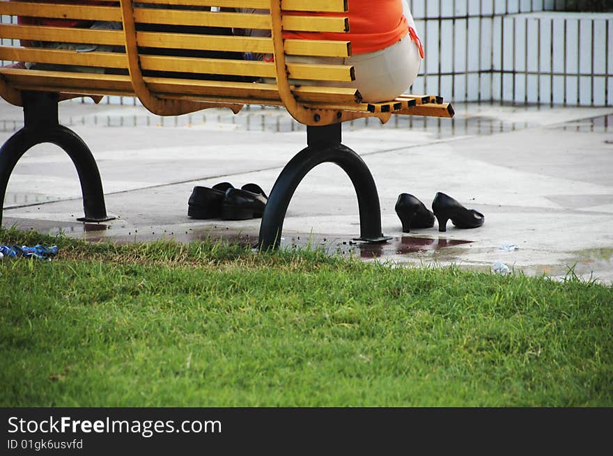 People sitting on a bench in china. People sitting on a bench in china