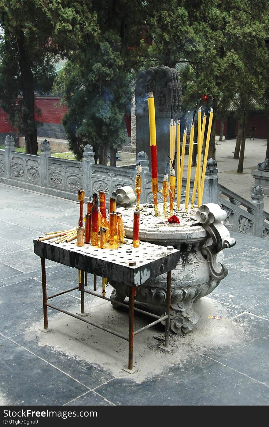 Offering burning incense sticks to Buddha, China, Shaolin