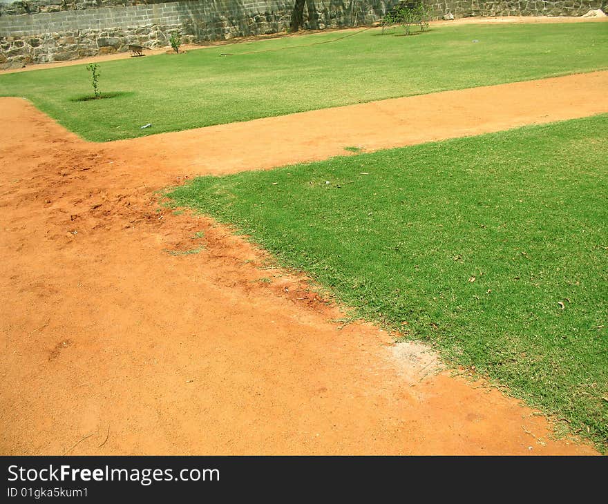 Field of cultivated and mowed grass with clear path. Field of cultivated and mowed grass with clear path.