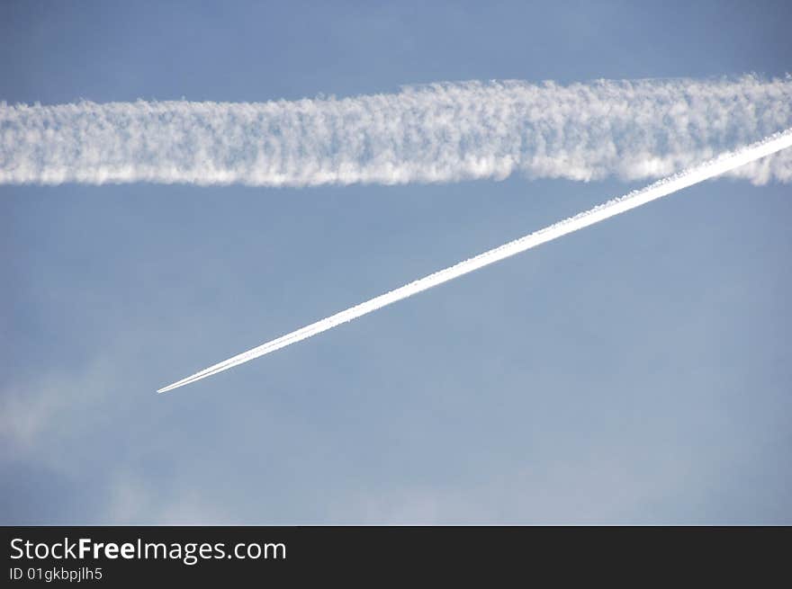 Clouds streaming and intersecting in the sky. Clouds streaming and intersecting in the sky