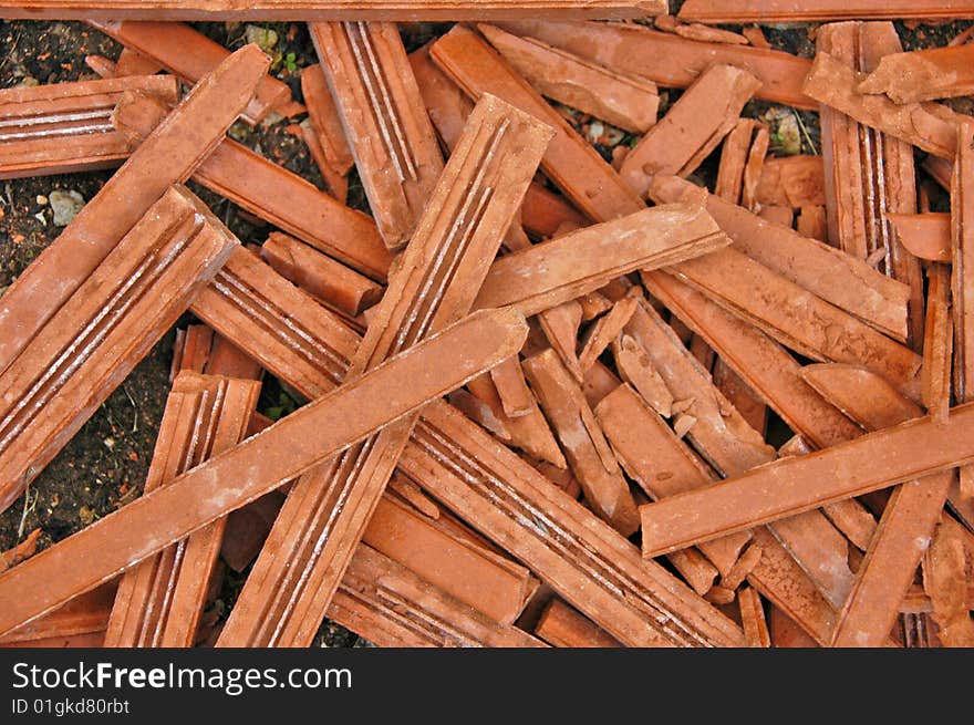 Heap of broken bricks near a building