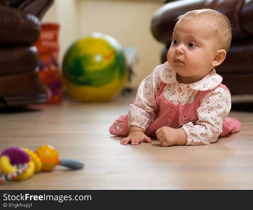 Little baby playing on floor. Little baby playing on floor