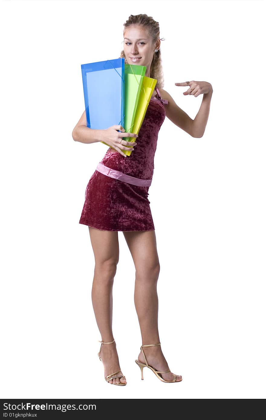 The young beautiful businesswoman at office behind work on a white background. The young beautiful businesswoman at office behind work on a white background