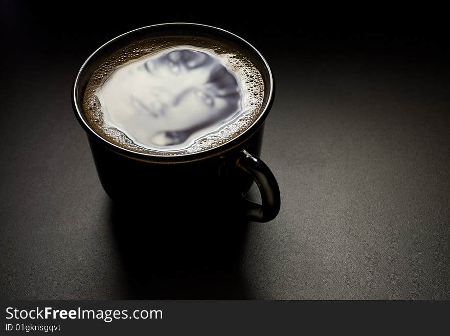 Reflected In A Cup Of Coffee