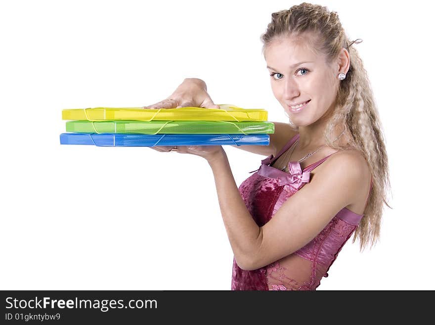 The young beautiful businesswoman at office behind work on a white background. The young beautiful businesswoman at office behind work on a white background