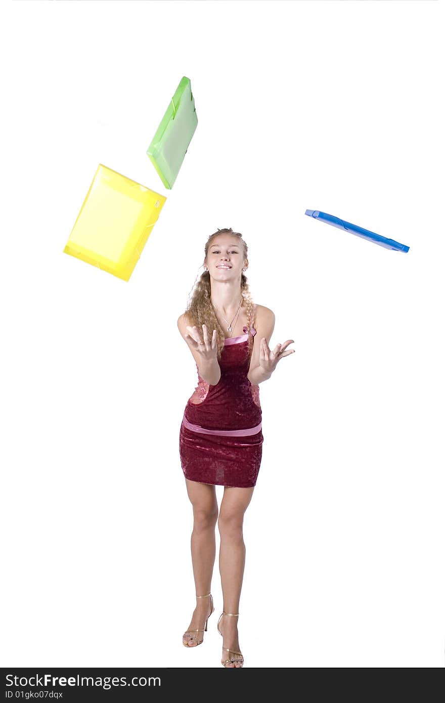 The young beautiful businesswoman at office behind work on a white background. The young beautiful businesswoman at office behind work on a white background