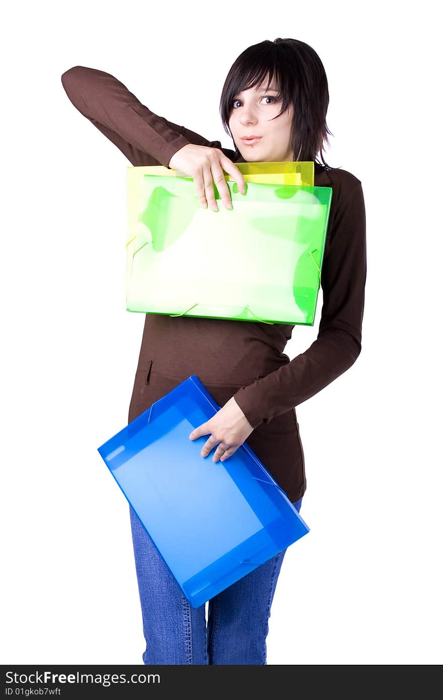 The young beautiful businesswoman at office behind work on a white background. The young beautiful businesswoman at office behind work on a white background