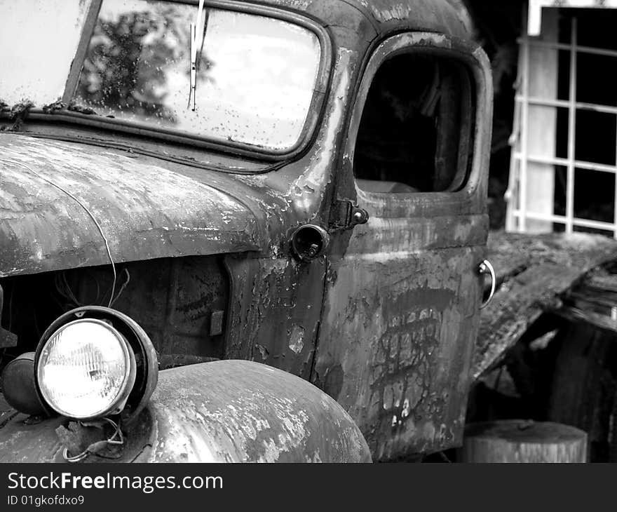 Old truck left to deteriorate slowly siting by the wayside slowly rusting away. Old truck left to deteriorate slowly siting by the wayside slowly rusting away.