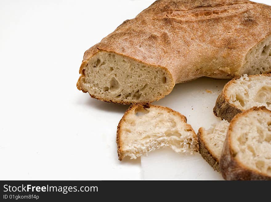 Sliced Italian bread on white background