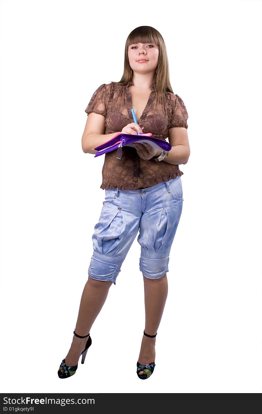 The young beautiful businesswoman at office behind work on a white background. The young beautiful businesswoman at office behind work on a white background