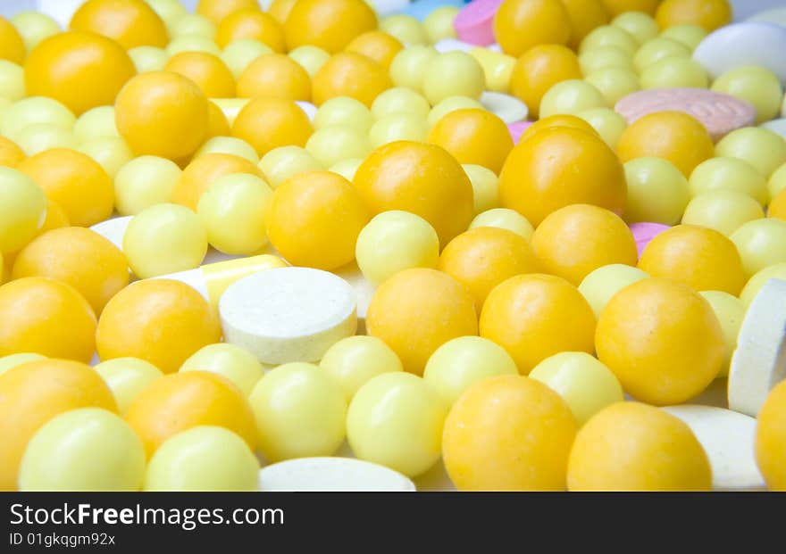 Close - up orange tablets of vitamines.