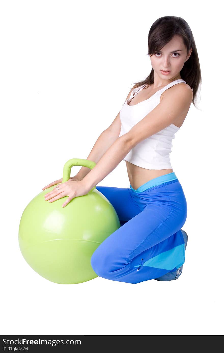 The young beautiful girl engaged in fitness on a white background. The young beautiful girl engaged in fitness on a white background