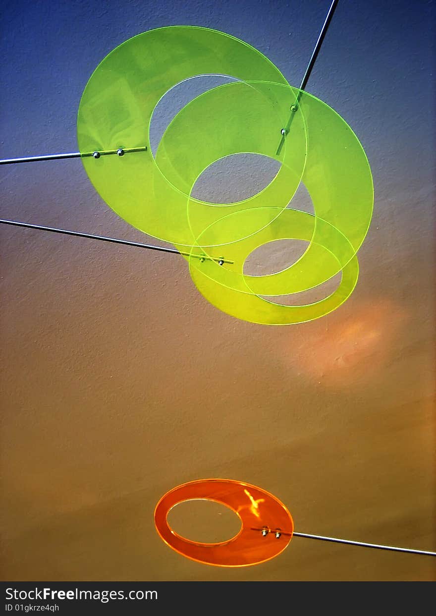 Floating transparent plastic circles with holes