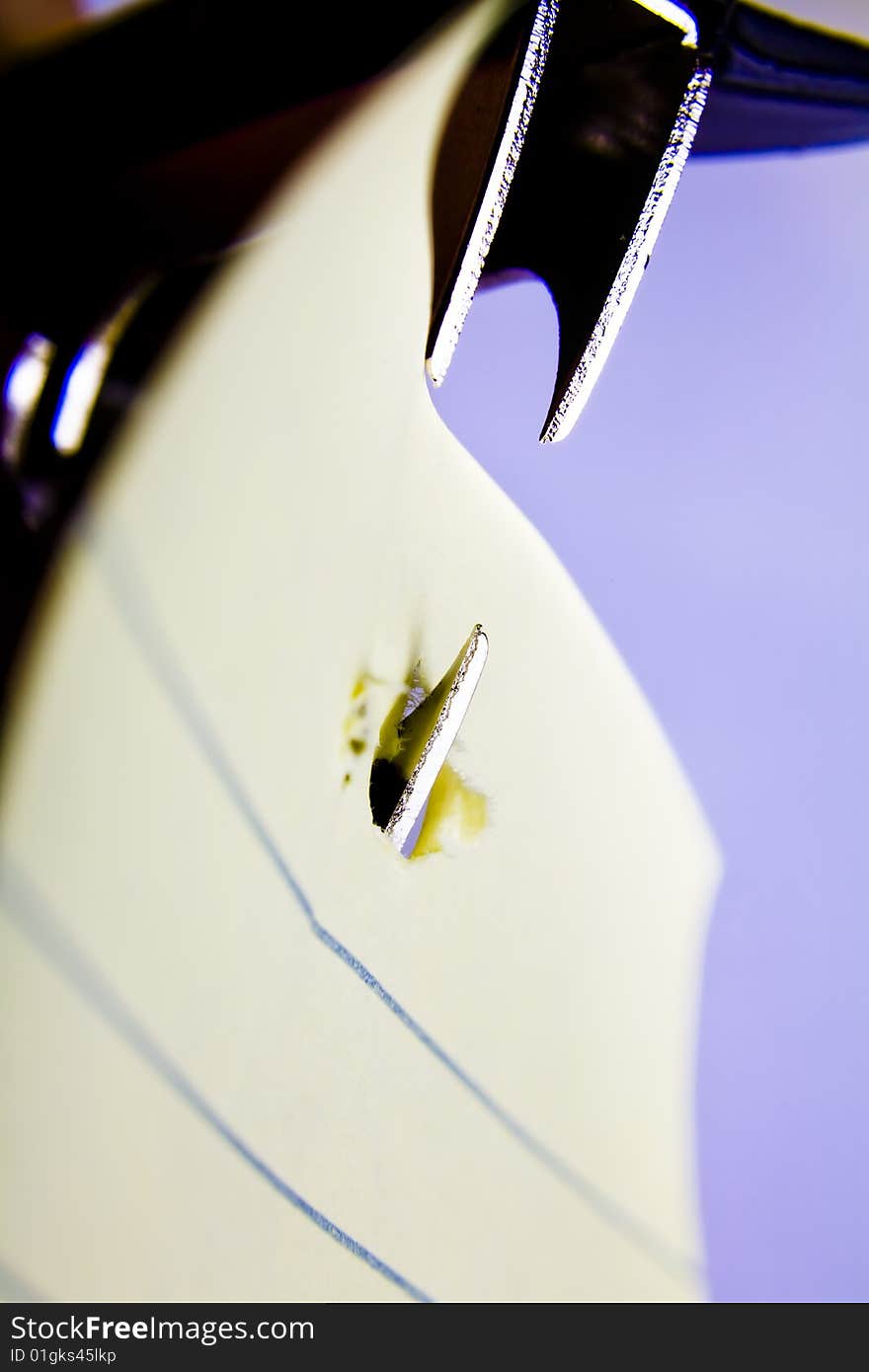 Close up of a Staple remover biting into paper