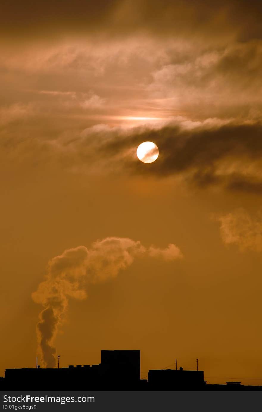 Smoke coming out of the factory in the sunrise. Smoke coming out of the factory in the sunrise