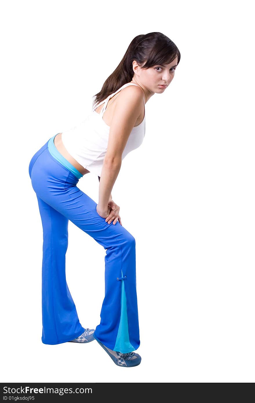 The young beautiful girl engaged in fitness on a white background. The young beautiful girl engaged in fitness on a white background