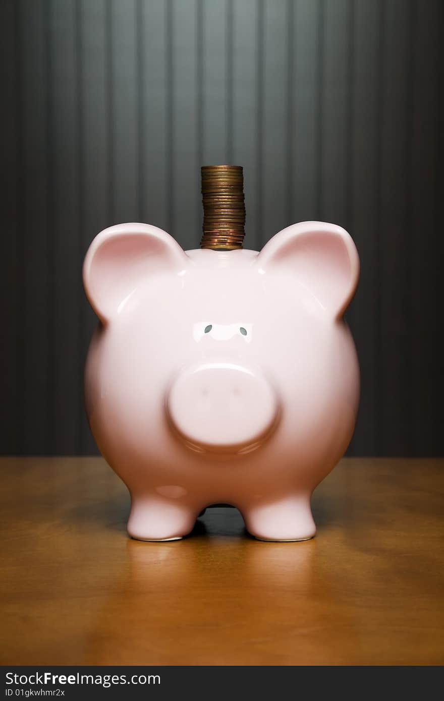 Stack of pennies placed on a Piggy bank. Stack of pennies placed on a Piggy bank