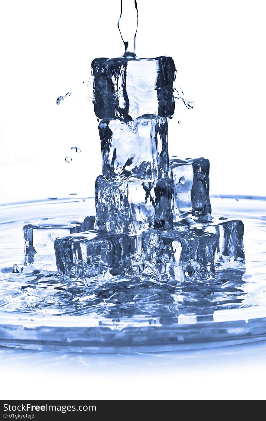 Pouring water onto ice cubes. Pouring water onto ice cubes