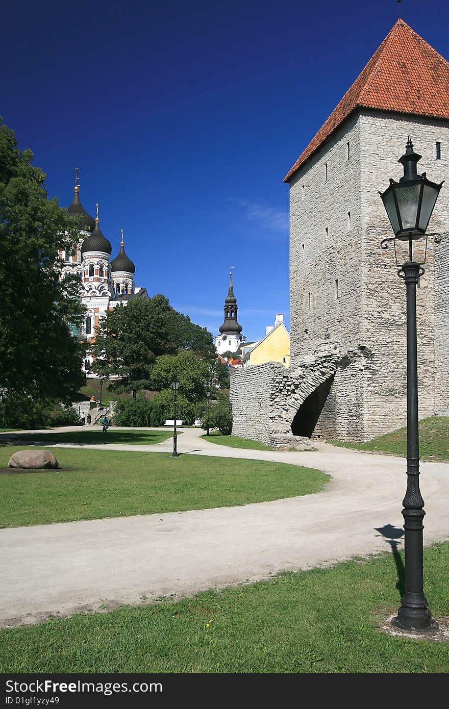 Sidewalk Garden Lamp with a castle on a city park, Talinn. Sidewalk Garden Lamp with a castle on a city park, Talinn