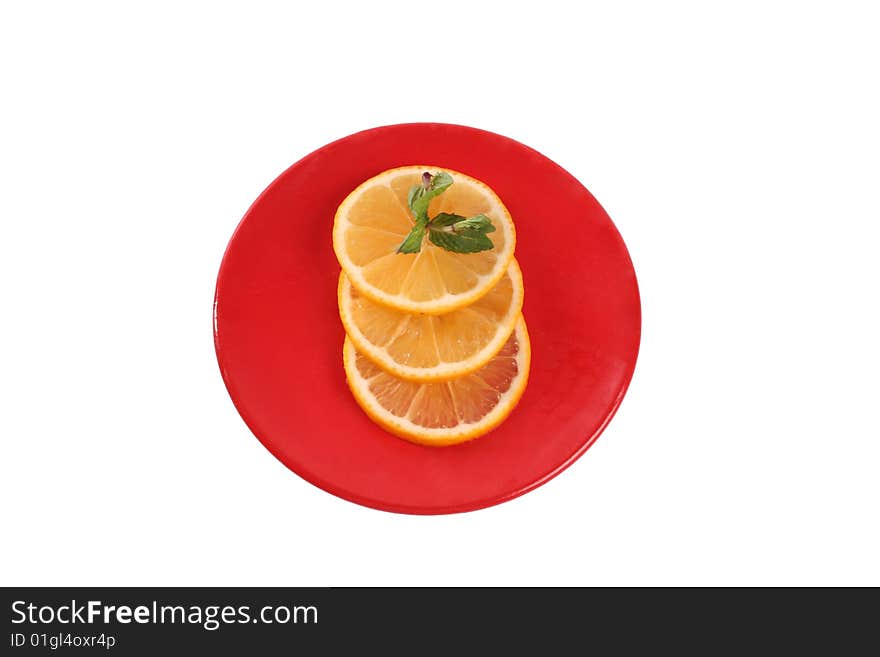 Three slice of orange and peppermint stem