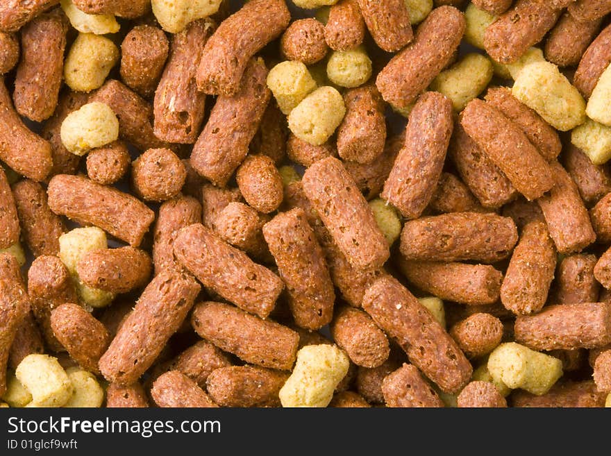 A close-up of a lot of dry reptile food. A close-up of a lot of dry reptile food