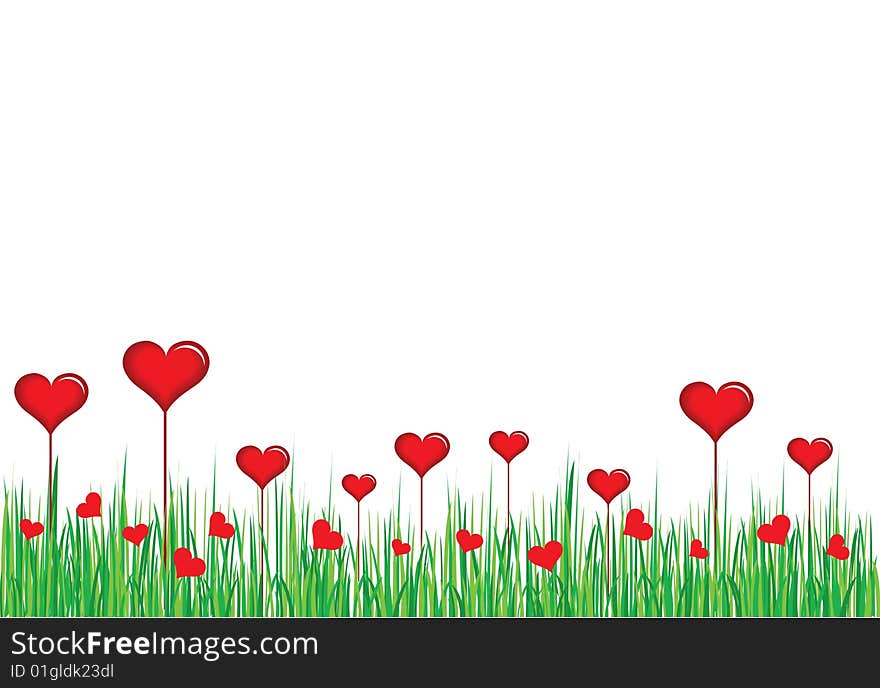 Red heart in green grass