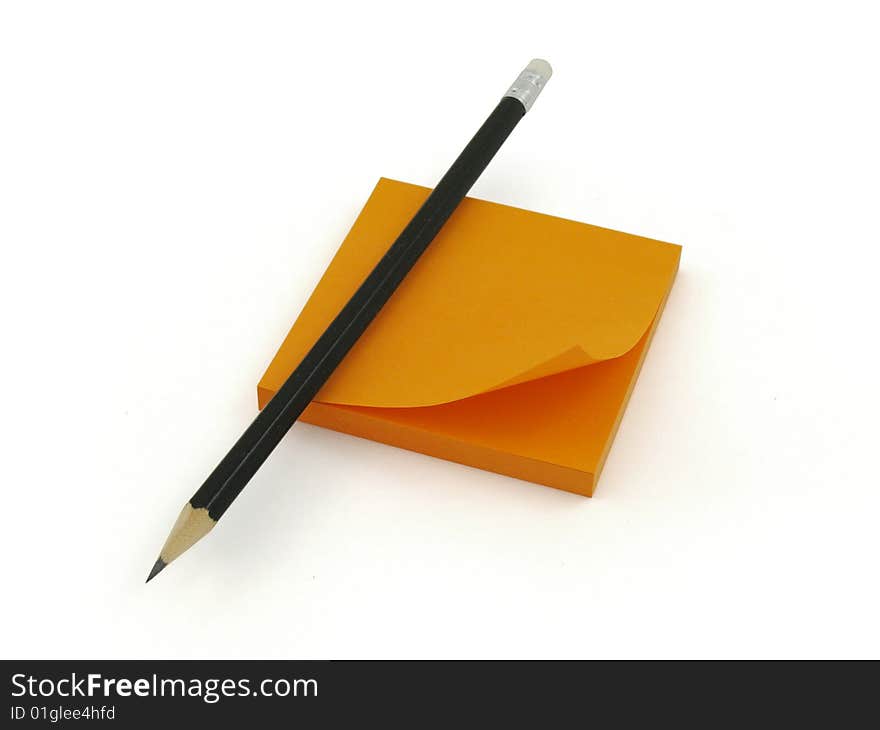 Pencil and orange sticker, white background