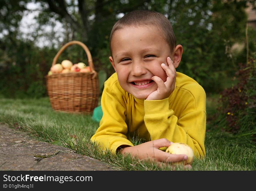 Boy posing outdoors with apples. Boy posing outdoors with apples