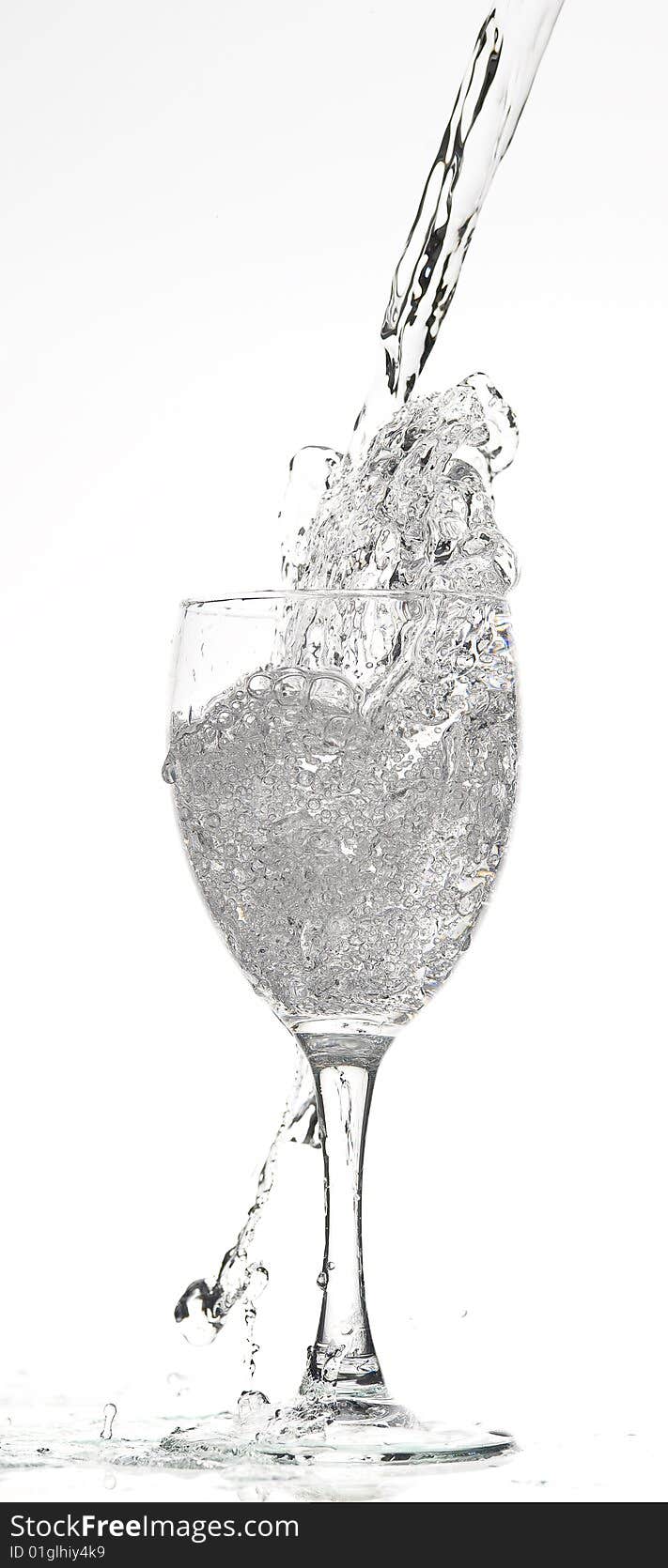 Glass with Splashing water. Coolness Drink. Glass with Splashing water. Coolness Drink