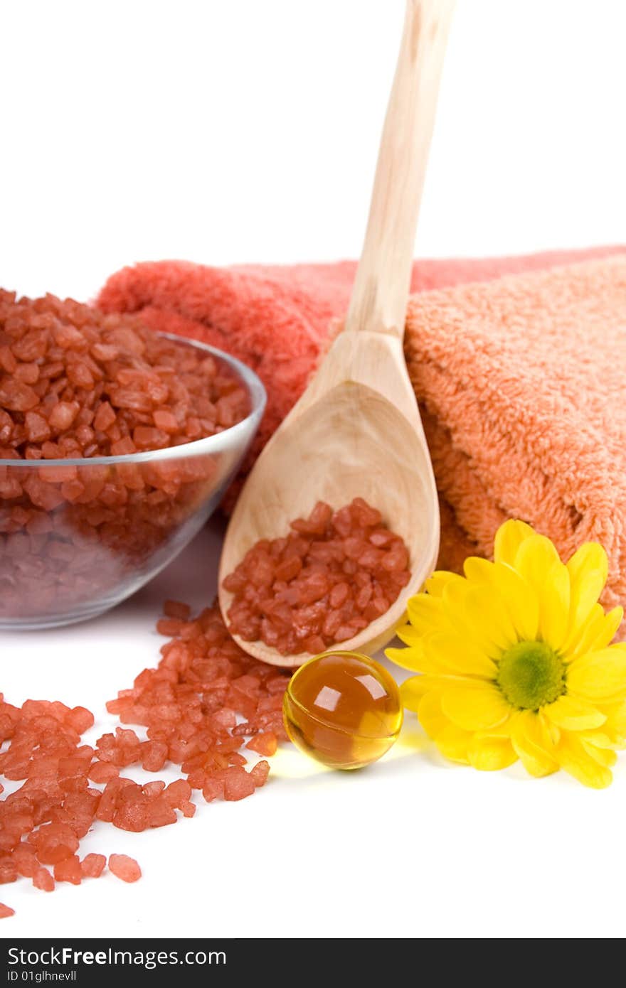 Spa pruducts: bath salt, oil balls, towels and flower