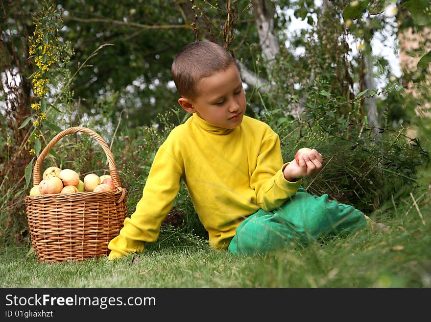 Little boy posing outdoors with apples. Little boy posing outdoors with apples