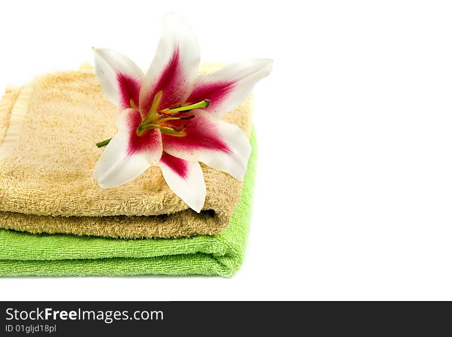 Towels and flower isolated on a white background