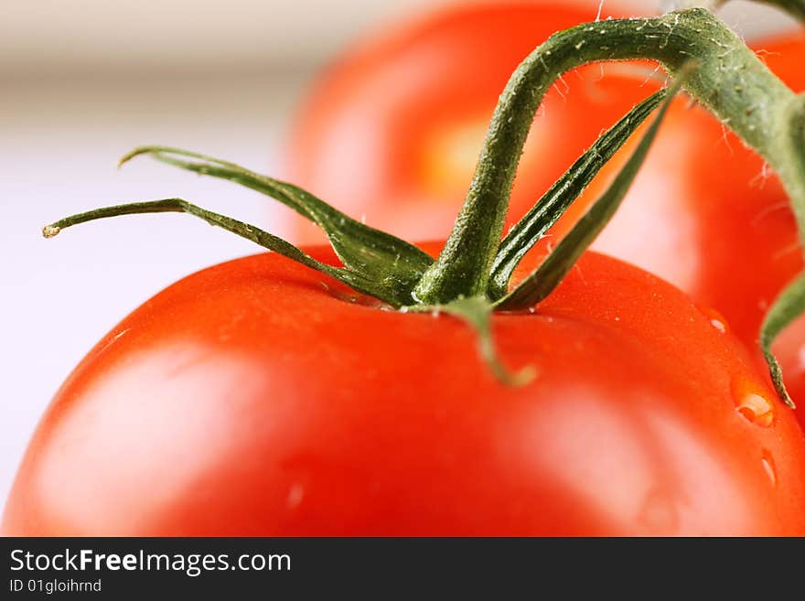 Red tomatoes with water drops