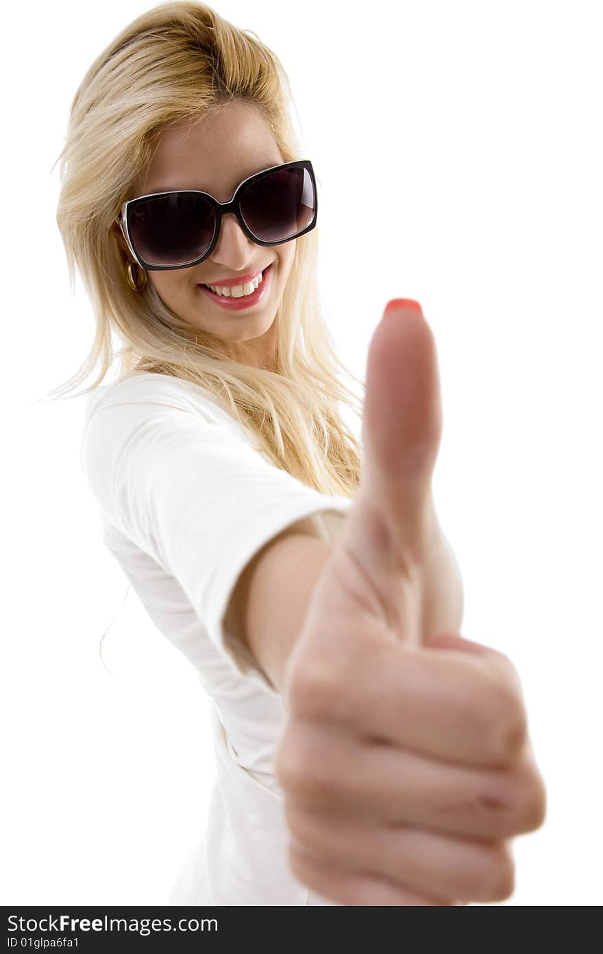 Side view of smiling woman showing thumbs up on an isolated background