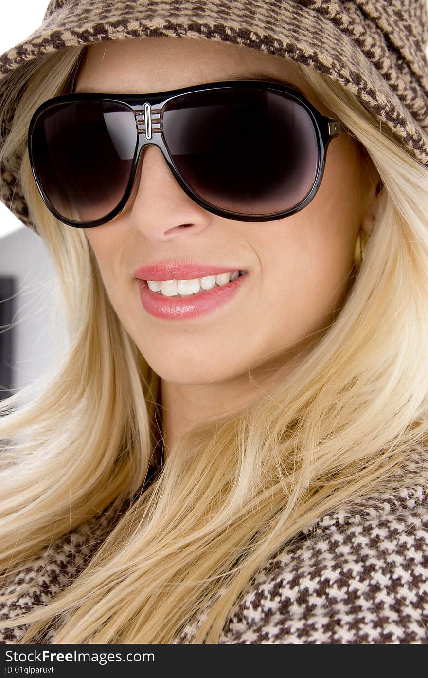 Front view of smiling model wearing sunglasses