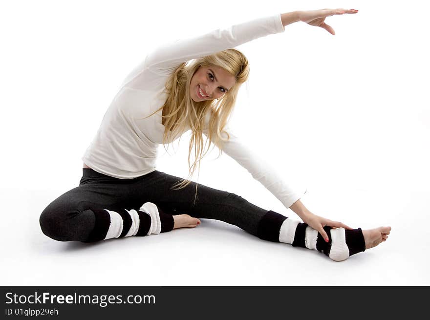 Front view of woman stretching on an isolated white background