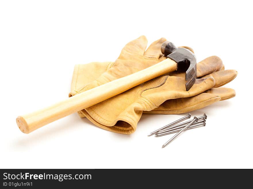 Hammer, Gloves and Nails Isolated on a White Background.