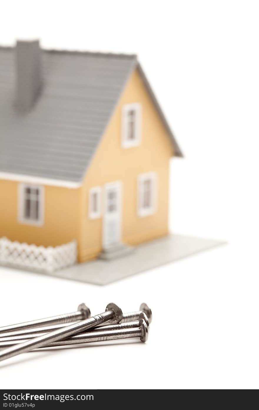 House and Nails Isolated on a White Background. House and Nails Isolated on a White Background.