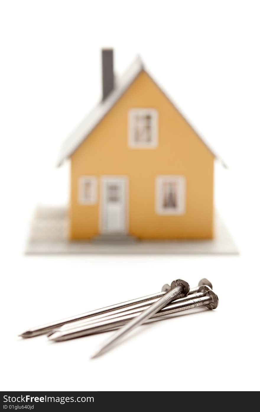 House and Nails Isolated on a White Background. House and Nails Isolated on a White Background.