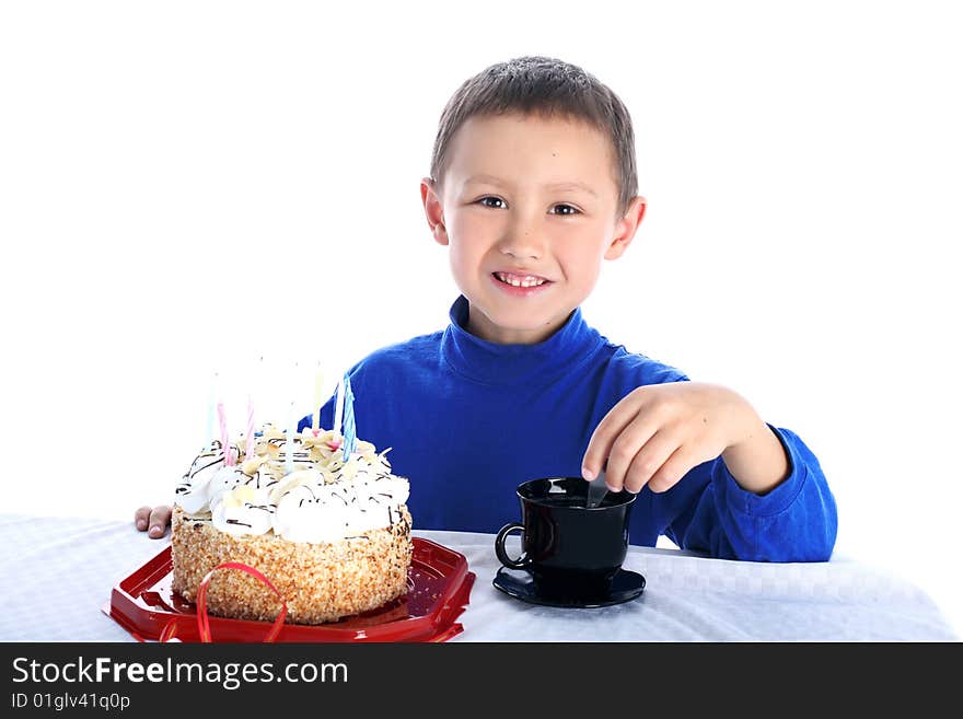 Little boy with birthday cake isolated on white