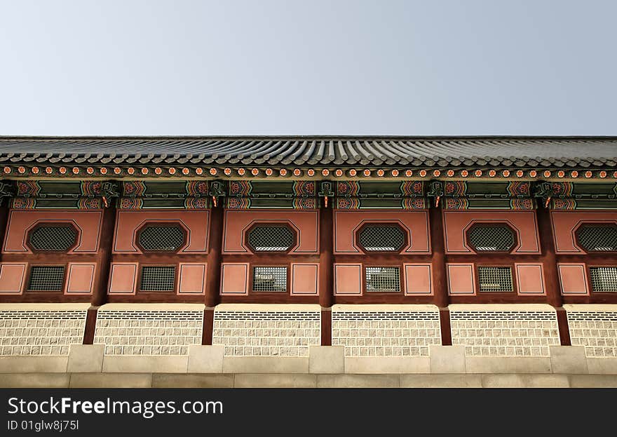 Long Asian Temple Wall against blue sky