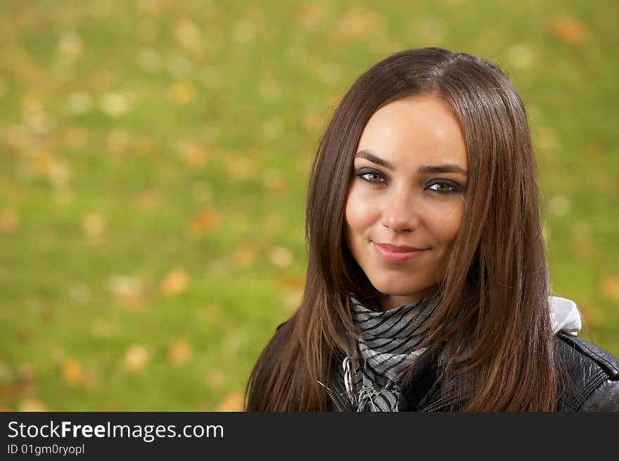 Portrait of the attractive girl against a lawn. Portrait of the attractive girl against a lawn