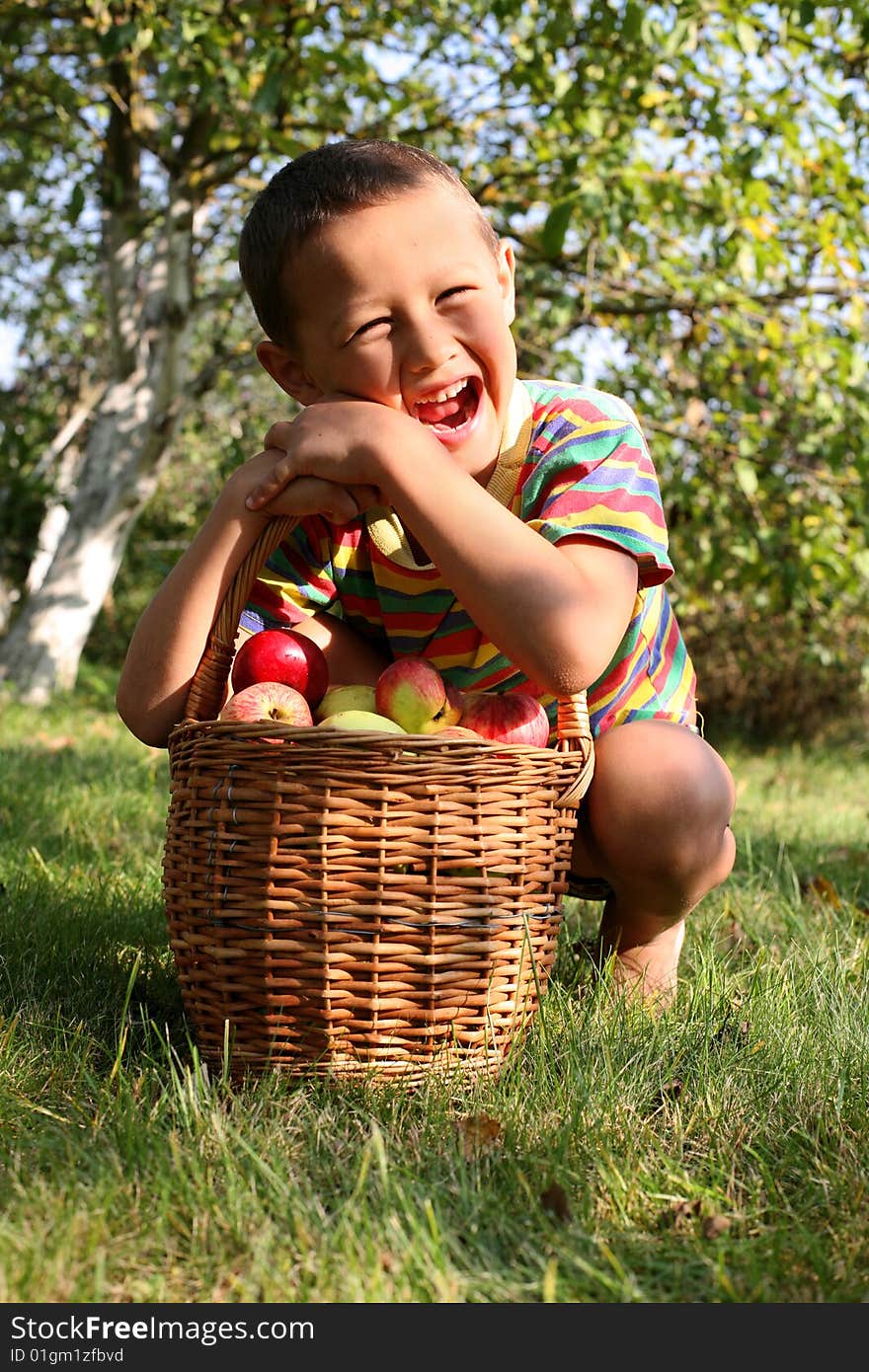 Boy with fresh apples outdoors. Boy with fresh apples outdoors