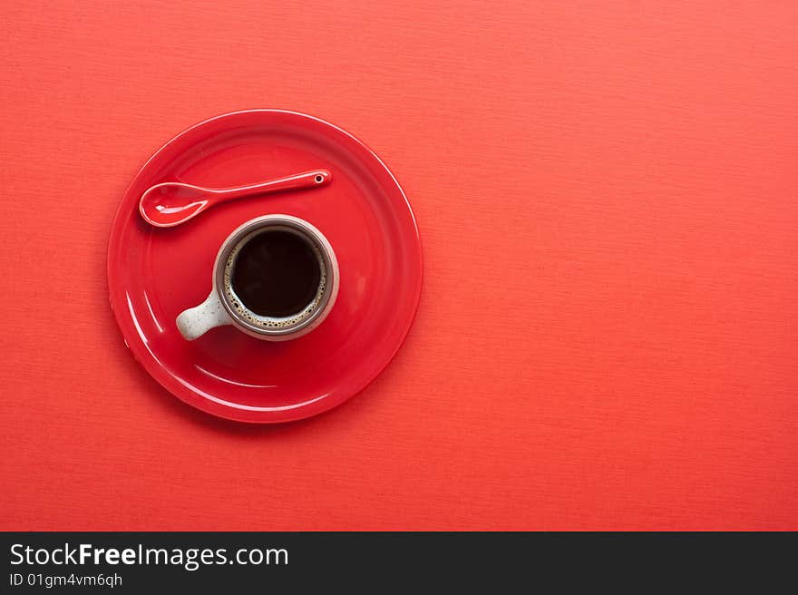 Coffee cup on red table. Many lot of copyspace