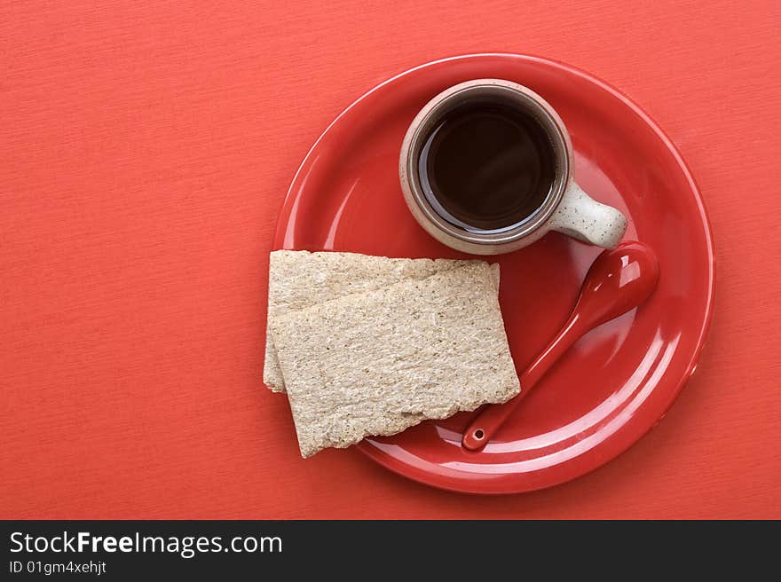 Breakfast. Coffee cup and toasts on red table. Many lot of copyspace