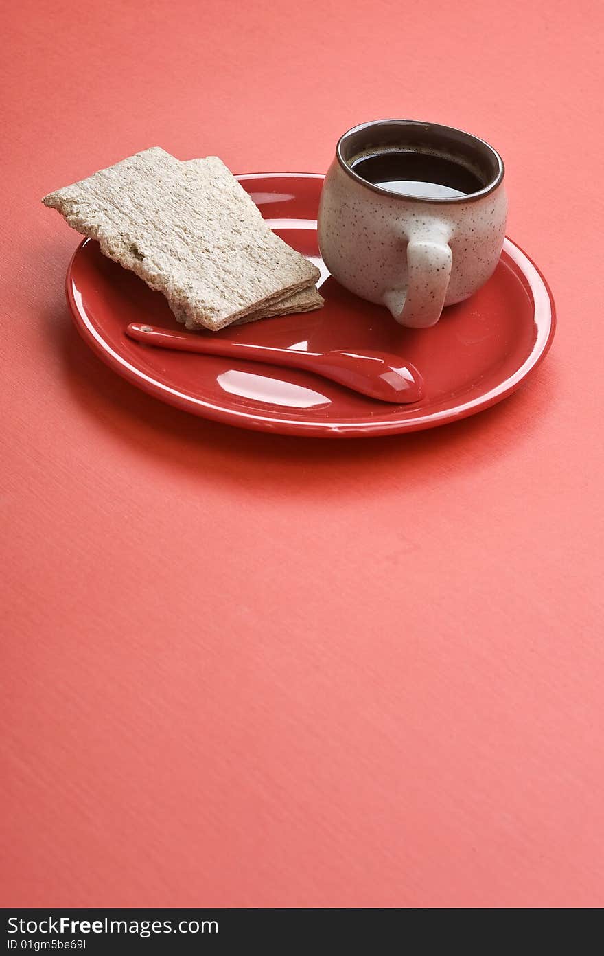 Breakfast. Coffee cup and toasts on red table. Many lot of copyspace